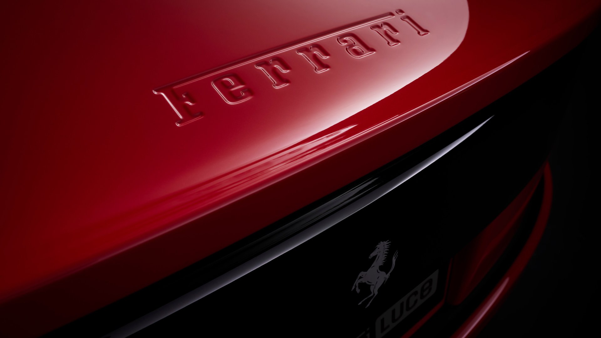 Ferrari Luce rear branding with embossed Ferrari script and Luce badge on red body